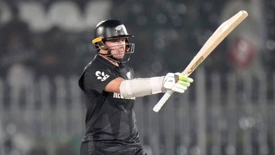 Tom Latham scored 56 runs off 77 balls and played second fiddle to Ravindra during their crucial stand. (AP Image) Tom Latham scored 56 runs off 77 balls and played second fiddle to Ravindra during their crucial stand. (AP Image)