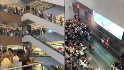 A viral video captures the electrifying moment when the entire mall, with people standing on multiple floors, paused to cheer for Kohli. (X/@onlyprathamesh) A viral video captures the electrifying moment when the entire mall, with people standing on multiple floors, paused to cheer for Kohli. (X/@onlyprathamesh)