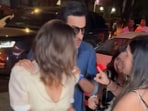Ranbir Kapoor protects Alia Bhatt as a fan grabs her hand. Ranbir Kapoor protects Alia Bhatt as a fan grabs her hand.
