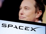 SpaceX logo and Elon Musk photo are seen in this illustration taken, December 19, 2022.