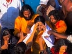 Katrina Kaif took a dip at the Sangam on Monday but a large crowd surrounded her.