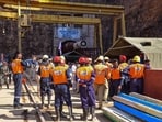 Members of National Disaster Response Force (NDRF) prepare for a rescue operation at Srisailam Left Bank Canal (SLBC) project tunnel in Nagarkurnool district of Telangana. Members of National Disaster Response Force (NDRF) prepare for a rescue operation at Srisailam Left Bank Canal (SLBC) project tunnel in Nagarkurnool district of Telangana.