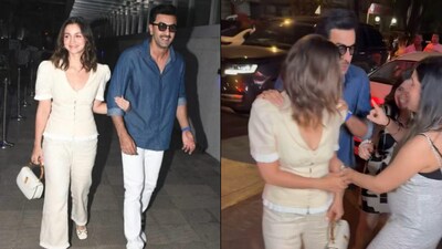 Ranbir Kapoor protects Alia Bhatt as a fan grabs her hand. Ranbir Kapoor protects Alia Bhatt as a fan grabs her hand.