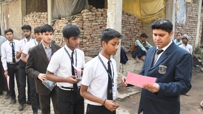 An official checking the documents of students before the commencement of CBSE Class 10 examination. (Santosh Kumar ) An official checking the documents of students before the commencement of CBSE Class 10 examination. (Santosh Kumar )