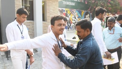 Students being frisked before the commencement of examination at an exam centre in Patna. (Santosh Kumar ) Students being frisked before the commencement of examination at an exam centre in Patna. (Santosh Kumar )