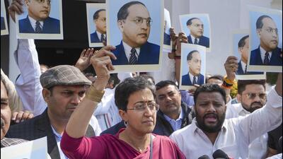 Leader of Opposition Atishi and other AAP MLAs stage a protest alleging removal of BR Ambedkar's potraits from CM office, during the first session of the Delhi Assembly on Tuesday. (PTI) Leader of Opposition Atishi and other AAP MLAs stage a protest alleging removal of BR Ambedkar's potraits from CM office, during the first session of the Delhi Assembly on Tuesday. (PTI)