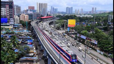 Mumbai, India - September 05, 2022: An aerial view of Metro train running slow during its dynamic testing on Metro Line-7 (Red Line) Phase-2 between Aarey Station and Andheri (East) Station on Western Express Highway, Jogeshwari, in Mumbai, India, on Monday, September 05, 2022. (Photo by Vijay Bate/HT Photo) (HT PHOTO) Mumbai, India - September 05, 2022: An aerial view of Metro train running slow during its dynamic testing on Metro Line-7 (Red Line) Phase-2 between Aarey Station and Andheri (East) Station on Western Express Highway, Jogeshwari, in Mumbai, India, on Monday, September 05, 2022. (Photo by Vijay Bate/HT Photo) (HT PHOTO)