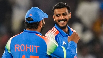 Axar Patel (R) with Rohit Sharma (PTI)