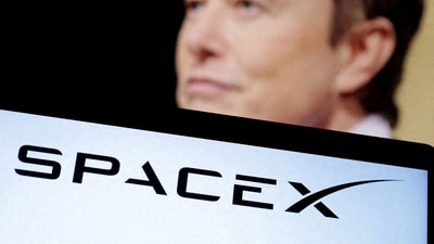 SpaceX logo and Elon Musk photo are seen in this illustration taken, December 19, 2022. (Dado Ruvic/Reuters)