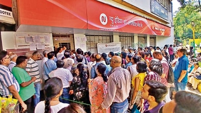 Thane, India - February 15, 2025: New India cooperative bank account holders are seen outside the bank, after the RBI imposed restrictions, India, on Saturday, February 15, 2024. (Praful Gangurde /HT Photo) Thane, India - February 15, 2025: New India cooperative bank account holders are seen outside the bank, after the RBI imposed restrictions, India, on Saturday, February 15, 2024. (Praful Gangurde /HT Photo)