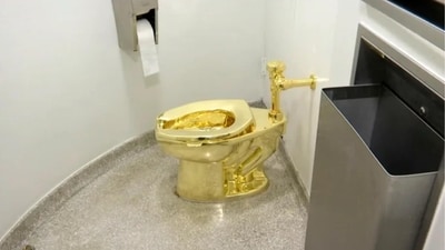 The 18-carat gold toilet weighed around 98 kg. (AP) The 18-carat gold toilet weighed around 98 kg. (AP)