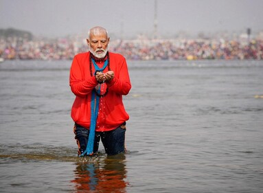 Prime Minister Narendra Modi prays as he takes a holy dip during the Maha Kumbh Mela on February 5, 2025. (REUTERS)