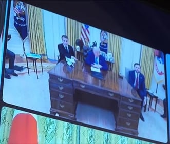 French president Emmanual Macron (L) in what seems like an uncomfortable seating at his US counterpart Donald Trump's Oval Office desk. (X/@MGonigle)