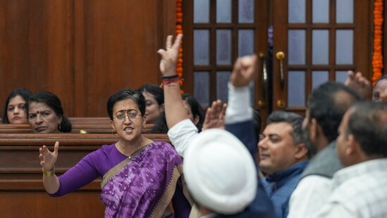 Leader of Opposition and AAP MLA Atishi and other party MLAs protest during the first day of the Delhi Legislative Assembly session, in New Delhi, Monday, (PTI)