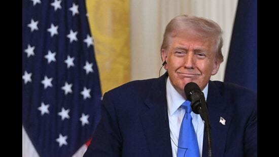 US President Donald Trump listens as French President Emmanuel Macron speaks during a joint press conference in the East Room to the White House in Washington, DC, on February 24, 2025. (Photo by ROBERTO SCHMIDT / AFP) (AFP)
