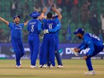 Afghanistan players celebrate after winning the match their Group B match against England
Afghanistan players celebrate after winning the match their Group B match against England