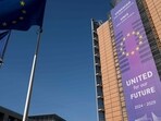 This photograph taken on February 18, 2025, shows the facade of the Berlaymont building, which houses the European Union Commission headquarters, and European Union flags, in Brussels. This photograph taken on February 18, 2025, shows the facade of the Berlaymont building, which houses the European Union Commission headquarters, and European Union flags, in Brussels.