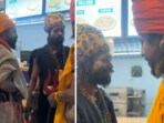 In the video, a woman is heard interacting with four sadhus inside a Dominos' outlet in Prayagraj. In the video, a woman is heard interacting with four sadhus inside a Dominos' outlet in Prayagraj.