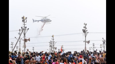 A helicopter showers flower petals on devotees gathered at Triveni Sangam to take a dip on the occasion of the Maha Shivratri during the ongoing 'MahaKumbh Mela 2025' in Prayagraj on Wednesday. (ANI) A helicopter showers flower petals on devotees gathered at Triveni Sangam to take a dip on the occasion of the Maha Shivratri during the ongoing 'MahaKumbh Mela 2025' in Prayagraj on Wednesday. (ANI)
