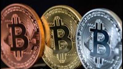 A picture taken on February 6, 2018 shows a visual representation of the digital crypto-currency Bitcoin, at the "Bitcoin Change" shop in the Israeli city of Tel Aviv. / AFP PHOTO / JACK GUEZ (AFP) A picture taken on February 6, 2018 shows a visual representation of the digital crypto-currency Bitcoin, at the "Bitcoin Change" shop in the Israeli city of Tel Aviv. / AFP PHOTO / JACK GUEZ (AFP)