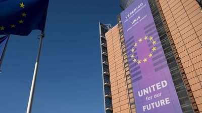 This photograph taken on February 18, 2025, shows the facade of the Berlaymont building, which houses the European Union Commission headquarters, and European Union flags, in Brussels. (AFP) This photograph taken on February 18, 2025, shows the facade of the Berlaymont building, which houses the European Union Commission headquarters, and European Union flags, in Brussels. (AFP)