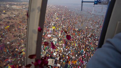 Government officials shower flower petals from a helicopter on pilgrims at the Sangam during Maha Kumbh, Feb. 26, 2025. (AP Photo/Rajesh Kumar Singh) Government officials shower flower petals from a helicopter on pilgrims at the Sangam during Maha Kumbh, Feb. 26, 2025. (AP Photo/Rajesh Kumar Singh)
