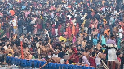 Pilgrims take a holy dip in Sangam during the Maha Kumbh Mela festival in Prayagraj on February 26, 2025. (AFP) Pilgrims take a holy dip in Sangam during the Maha Kumbh Mela festival in Prayagraj on February 26, 2025. (AFP)