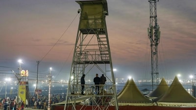 Police stand guard on a watch tower as pilgrims take a holy dip in Sangam on the occasion of Maha Shivaratri, on the last day of the Maha Kumbh Mela festival in Prayagraj. (Niharika Kulkarni/AFP) Police stand guard on a watch tower as pilgrims take a holy dip in Sangam on the occasion of Maha Shivaratri, on the last day of the Maha Kumbh Mela festival in Prayagraj. (Niharika Kulkarni/AFP)