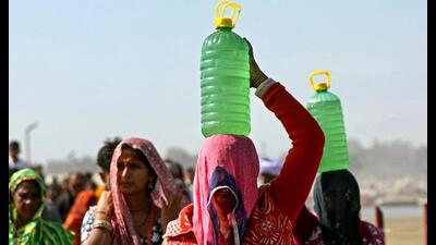 Pilgrims carry holy water from Sangam, the confluence of Ganges, Yamuna and mythical Saraswati rivers during the Mahakumbh in Prayagraj. (AFP) Pilgrims carry holy water from Sangam, the confluence of Ganges, Yamuna and mythical Saraswati rivers during the Mahakumbh in Prayagraj. (AFP)