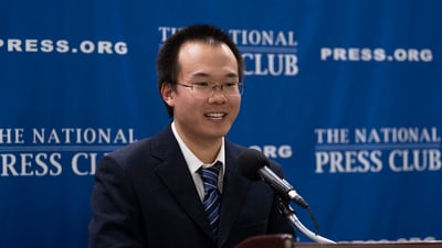 Dong Yifu, the son of imprisoned Chinese veteran journalist Dong Yuyu who was sentenced to seven years in prison on espionage charges, speaks about his father's detention to the National Press Club in Washington (AP)