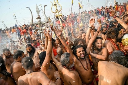 Naga Sadhus take a dip in Sangam in Prayagraj. (AFP)