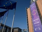 This photograph taken on February 18, 2025, shows the facade of the Berlaymont building, which houses the European Union Commission headquarters, and European Union flags, in Brussels. This photograph taken on February 18, 2025, shows the facade of the Berlaymont building, which houses the European Union Commission headquarters, and European Union flags, in Brussels.
