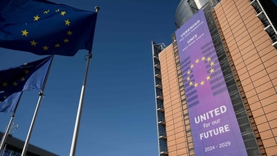 This photograph taken on February 18, 2025, shows the facade of the Berlaymont building, which houses the European Union Commission headquarters, and European Union flags, in Brussels. (AFP) This photograph taken on February 18, 2025, shows the facade of the Berlaymont building, which houses the European Union Commission headquarters, and European Union flags, in Brussels. (AFP)
