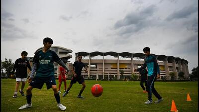Boys make the most of the cloud cover on Thursday evening to have a spirited game of football at the Noida stadium. (Sunil Ghosh/HT Photo) Boys make the most of the cloud cover on Thursday evening to have a spirited game of football at the Noida stadium. (Sunil Ghosh/HT Photo)