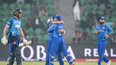 Afghanistan's players celebrate after the dismissal of England's captain Jos Buttler (L) during the ICC Champions Trophy one-day international (ODI) cricket match between England and Afghanistan at the Gaddafi Stadium in Lahore on February 26, 2025. (Photo by Aamir QURESHI / AFP) (AFP) Afghanistan's players celebrate after the dismissal of England's captain Jos Buttler (L) during the ICC Champions Trophy one-day international (ODI) cricket match between England and Afghanistan at the Gaddafi Stadium in Lahore on February 26, 2025. (Photo by Aamir QURESHI / AFP) (AFP)
