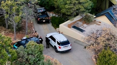 Law enforcement officials talk outside the home of actor Gene Hackman on Thursday, Feb. 27, 2025 in Santa Fe, New Mexico. Hackman, his wife Betsy Arakawa and their dog were found dead in the home a day earlier. (Roberto Rosales/ AP) Law enforcement officials talk outside the home of actor Gene Hackman on Thursday, Feb. 27, 2025 in Santa Fe, New Mexico. Hackman, his wife Betsy Arakawa and their dog were found dead in the home a day earlier. (Roberto Rosales/ AP)