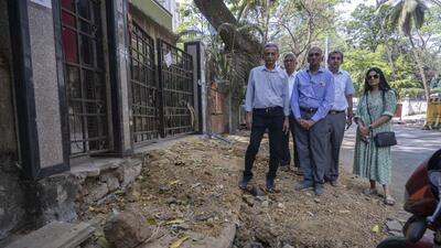 Given the considerable height gap between housing society premises and the road, residents are unable to take their cars even in times of emergency, they said (Satish Bate/ Hindustan Times)