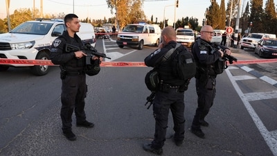 Members of the Israeli security forces gather outside a cordoned-off area where a vehicle reportedly rammed into pedestrians at the Karkur junction south of the city of Haifa in northern Israel on February 27, 2025. (AFP) Members of the Israeli security forces gather outside a cordoned-off area where a vehicle reportedly rammed into pedestrians at the Karkur junction south of the city of Haifa in northern Israel on February 27, 2025. (AFP)