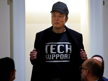 Elon Musk in his "Tech Support" t-shirt and 'Make America Great Again' campaign hat at the Cabinet meeting. (Reuters)