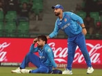 Afghanistan's Hashmatullah Shahidi (c) and Rashid Khan react during a match. Afghanistan's Hashmatullah Shahidi (c) and Rashid Khan react during a match.