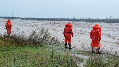 A National Disaster Response Force team inspecting the banks of the Tawi river as the water level rose in Jammu on Friday. (ANI Photo) A National Disaster Response Force team inspecting the banks of the Tawi river as the water level rose in Jammu on Friday. (ANI Photo)