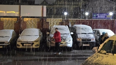 People walk through heavy snowfall in Srinagar, Jammu and Kashmir, on Thursday, February 27, 2025. (PTI) People walk through heavy snowfall in Srinagar, Jammu and Kashmir, on Thursday, February 27, 2025. (PTI)