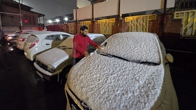 A man clears snow from a car's windshield amid heavy snowfall in Srinagar, Jammu and Kashmir, on Thursday, February 27, 2025. The higher-altitude areas received moderate to heavy snowfall, forcing the closure of multiple roads, including the crucial 270-km Jammu-Srinagar national highway. (PTI) A man clears snow from a car's windshield amid heavy snowfall in Srinagar, Jammu and Kashmir, on Thursday, February 27, 2025. The higher-altitude areas received moderate to heavy snowfall, forcing the closure of multiple roads, including the crucial 270-km Jammu-Srinagar national highway. (PTI)