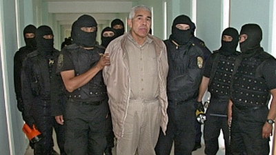 Members of the Federal Preventive Police guard drug trafficker Rafael Caro Quintero (C) after an operation at the Puente Grande prison in Guadalajara, Jalisco, on January 29, 2005. (AFP PHOTO / MEXICAN FEDERAL PREVENTIVE POLICE) Members of the Federal Preventive Police guard drug trafficker Rafael Caro Quintero (C) after an operation at the Puente Grande prison in Guadalajara, Jalisco, on January 29, 2005. (AFP PHOTO / MEXICAN FEDERAL PREVENTIVE POLICE)