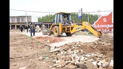The district town planning team carrying out demolition of an illegal warehouse in Garhi Kotaha village in Panchkula on Friday. (HT Photo)