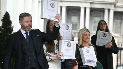 Unidentified people carrying binders bearing the seal of the US Justice Department reading "The Epstein Files: Phase 1" walk out of the West Wing of the White House in Washington, DC, on February 27, 2025. The Trump administration has said it would release documents on late tycoon and convicted sex trafficker Jeffrey Epstein who was found dead in his prison cell in 2019. (Photo by Jim WATSON / AFP) (AFP) Unidentified people carrying binders bearing the seal of the US Justice Department reading "The Epstein Files: Phase 1" walk out of the West Wing of the White House in Washington, DC, on February 27, 2025. The Trump administration has said it would release documents on late tycoon and convicted sex trafficker Jeffrey Epstein who was found dead in his prison cell in 2019. (Photo by Jim WATSON / AFP) (AFP)
