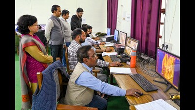 Uttar Pradesh Board officers keep track of the visuals captured on CCTV cameras, at the Control room, after the conclusion of the Mahakumbh Mela, in Prayagraj on Friday. (PTI)