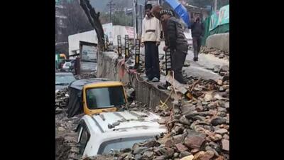 Vehicles buried in debris after a flashflood triggered by heavy rain in Kullu on Friday. (HT Photo) Vehicles buried in debris after a flashflood triggered by heavy rain in Kullu on Friday. (HT Photo)