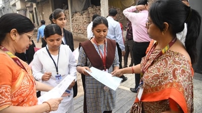 Invigilators checking admit card of appearing candidates outside St. Dominic savio's high school Danapur in patna (Santosh Kumar ) Invigilators checking admit card of appearing candidates outside St. Dominic savio's high school Danapur in patna (Santosh Kumar )