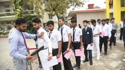 CBSE Class 10 students being checked by invigilator before entering St. Dominic savio's high school Danapur in patna (Santosh Kumar ) CBSE Class 10 students being checked by invigilator before entering St. Dominic savio's high school Danapur in patna (Santosh Kumar )